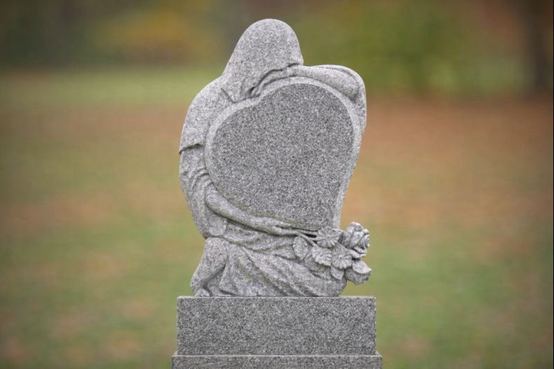 Guardian Embrace Heart Granite Headstone