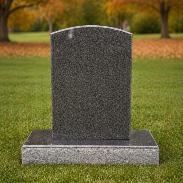 Upright granite headstone in cemetery with classic rectangular shape